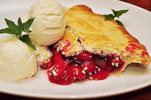 Cherry pie with ice cream.