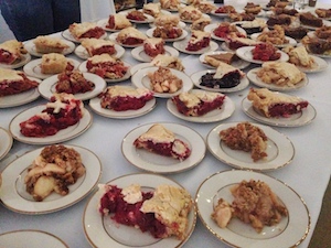 Buffet of pie slices.